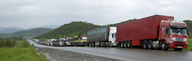 WAITING FOR GODOT- Trucks seeking to leave Iran are backed up far into Iran as Iranian customs takes its time clearing them.