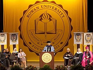 TAKING CHARGE — Ali A. Houshmand (at rostrum) was sworn-in Friday as the seventh president of Rowan University in Glassboro, New Jersey.