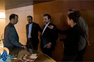 ANSWER MAN — Deputy Foreign Minister Abbas Araqchi (center) was interviewed by Israeli reporters who intercepted him in a Geneva hotel.  The daily Mashreq said Araqchi didn’t know who they were.  But notice the aide (second from left) tugging at Araqchi’s sleeve to get him to move on.