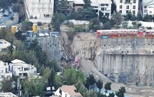 ANOTHER LOSS — Among many projects, Babak Zanjani has started building a multi-story shopping center on this site in western Tehran.  But last week, a water main broke and the resulting water flow tore down part of the retaining wall where workmen have been digging down.