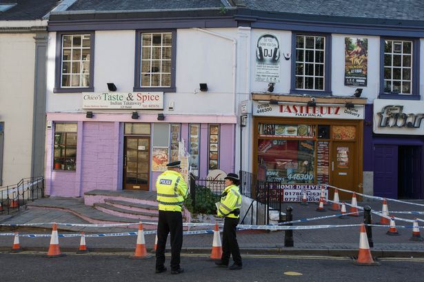 DEATH SCENE — Ahmed Yazdanparast operates the food take-shop at left and his wife had a hair salon in the basement.