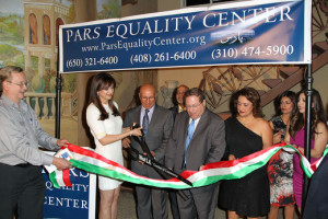 OPENING UP — The ribbon is cut to open the new Pars Equality Center for Los Angeles.  From left, Pars founder and director Bita Daryabari, Pars chief of social services Reza Odabaee, LA City Councilmember Paul Koretz, Laleh Kazini and Pars director of legal services Nazy Fahimi.