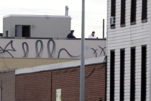 CRIME SCENE — Police scour the roof of the Brooklyn townhouse where the man who killed three fellow musicians was found dead, an assumed suicide.