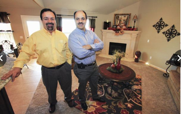 BUILDERS — Mohammad Farzaneh (left) and his brother Jalal show off one of the many homes they have built in Oklahoma.