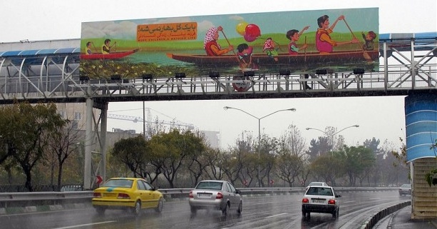 MISERY AT HOME — Posters over Tehran highways urge couples to have lots of children, saying that families with only one child are miserable.
