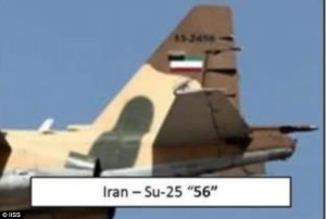 TAIL TALE — This is the tail of the plane above.  The Iranian flag photographed on the Iranian plane at right has been painted over, but note that the camouflaged splotch beginning on the bottom of the tail and going over the fuselage is identical.