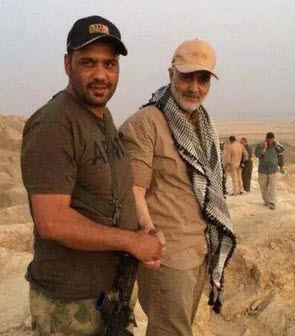 AT WORK — Gen. Qassem Soleimani (right) was photographed last week in Iraq with an unidentified Iraqi militiaman wearing a US Army t-shirt.