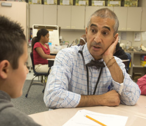 TEACH—Mohsen Ghaffari works with one of his students in Salt Lake City.