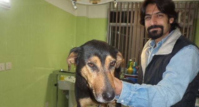 BEWARE OF THE DOG — Ali Tabarzadi is seen with one of his best friends before his arrest. 