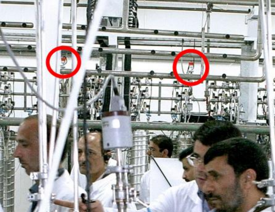 EVIDENCE — Prosecutors say this photo taken a few years ago while President Ahmadi-nejad (lower right) was visiting the Natanz uranium enrichment plant shows two of the US-made transducers (circled) that Sihai Cheng sold Iran.