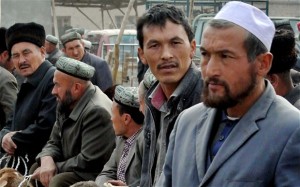 CHINA — Uighurs gather at a bazaar.  Iran has been silent about efforts by the Chinese government to suppress the practice of the Ramadan fast.