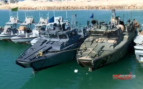 LOCKED IN DOCK — The two US Navy riverine boats were photographed while docked at Farsi Island between Pasdar vessels.  The US Navy boats are each 49-feet long (15 meters) and carry three .50 caliber machine guns.
