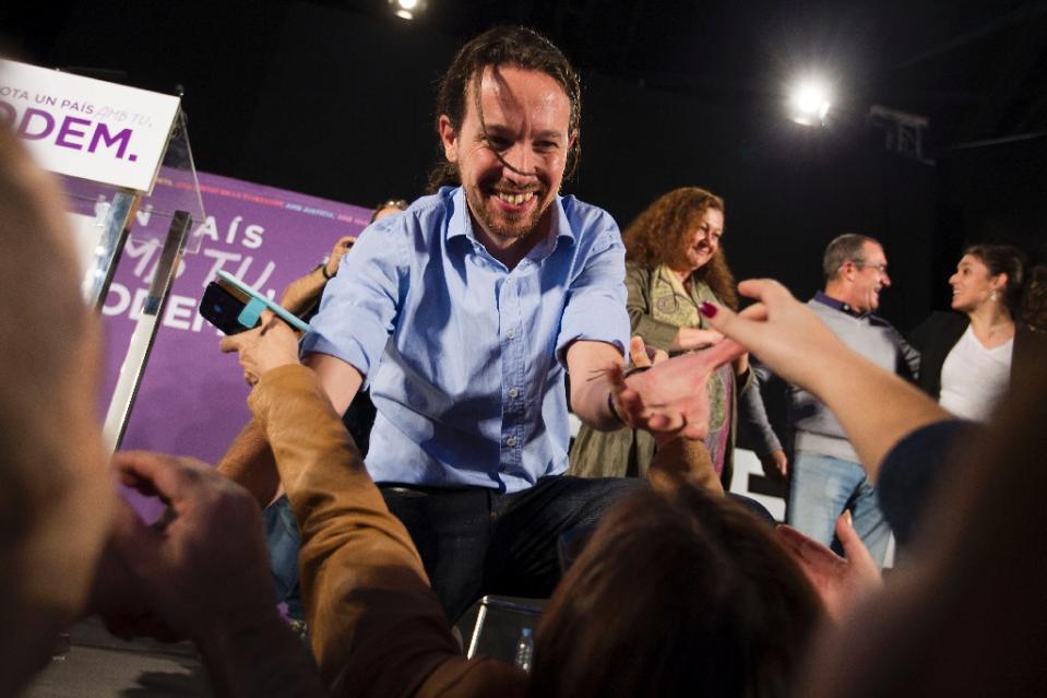 CAMPAIGNING — Pablo Iglesias, founder and leader of the Podemos Party, is seen pressing the flesh in last month’s election campaign.