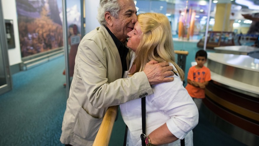 IN CANADA — Parviz Tanavoli embraces his wife, Manijeh, on his arrival at the Vancouver airport.