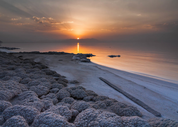 NO LONGER RECEDING — The sun sets over the salt-encrusted beach of Lake Urumiyeh, which has recently ceased shrinking.