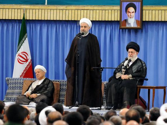 IN CHARGE — President Rohani stands beside the boss, Supreme Leader Ali Khamenehi.