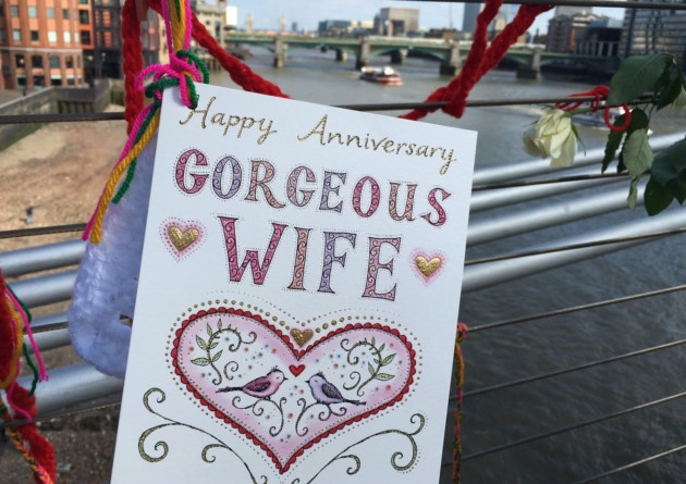 NOT SO HAPPY— Richard Ratcliffe posted this poster-sized anniverary card to his imprisoned wife on the Millennium Bridge across the Thames in London.