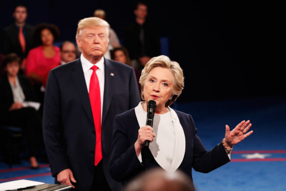 HOVERING — Donald Trump tended to hover in the background as Hillary Clinton spoke Sunday during the second presidential campaign debate.