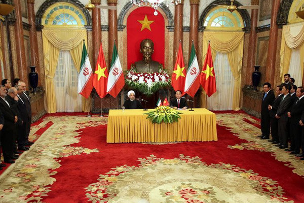 WELCOME — Vietnam received President Rohani (left at table) lavishly in Hanoi.