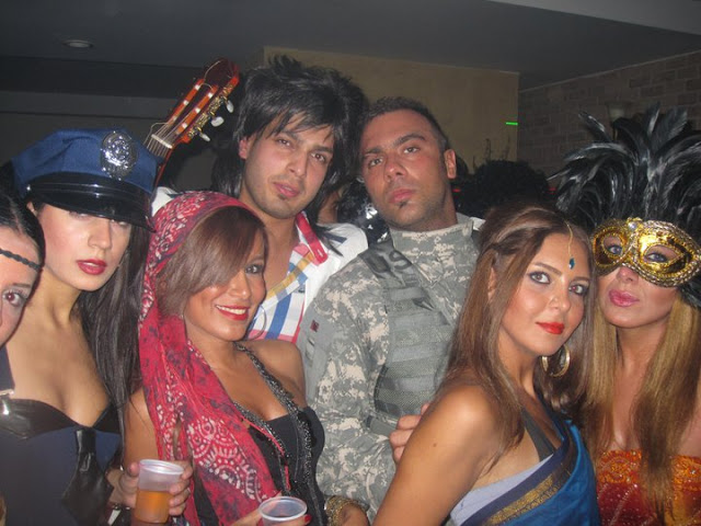 AVERT YOUR EYES — The state of dress at this Tehran Halloween party definitely would not pass muster with the Pasdaran.