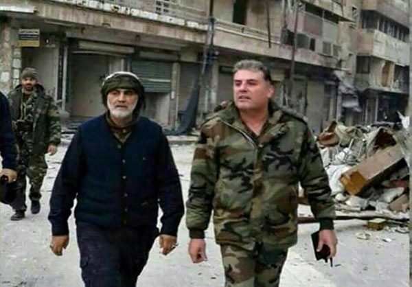 SYRIA CALLING — This photo appeared on social media this week showing Qods Force commander, Gen. Qasem Soleymani (left), walking in the streets of Aleppo after its fall.