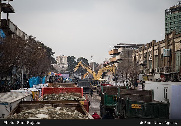 FROM TOWER TO EMPTY SITE — A huge fleet of dump trucks had to be mobilized to cart away the remains of the 17-story Plasco building.  After nine days of work, the site has now been cleared. It hasn’t been decided what will be built on the site next.