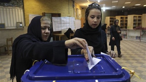BALLOT BOX — Women are seen voting four years ago.  After many years of American criticism of Iran’s election system, the Islamic Republic has only now decided to get angry and reply.