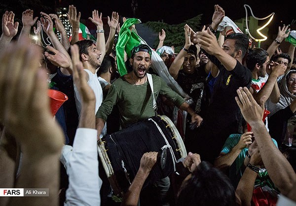 CELEBRATION — Tehranis poured into the streets Monday to celebrate as  the Iranian national soccer team became only the second team in the world to earn a berth in the 2018 World Cup finals to be played next summer in Russia.  See full standings on Page Seven.