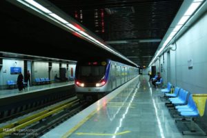 TRAVELING — A Metro train pulls into an above-ground station in Tehran.