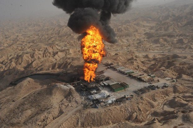 BIG BLOW — Flames fed by a crude oil blowout under great pressure fill the sky in Khuzestan province.