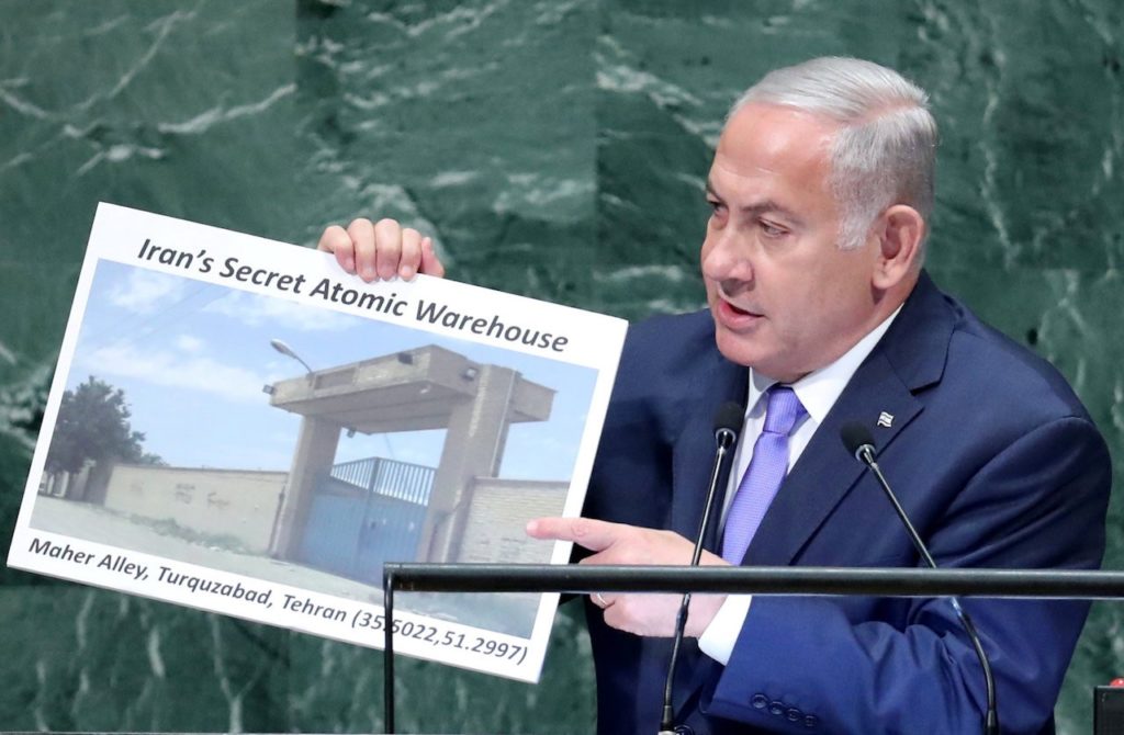 SHOW OFF—Netanyahu and his 2018 Iran poster. Israeli Prime Minister  