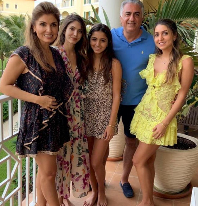 FAMILY — Reza Pahlavi and his wife, Yasmine, (left) pose with their three daughters.