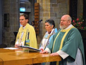 FIRST TIME — Guli Francis-Dehqani (center), the only Iranian-born bishop in the Church of England, conducts the first Anglican service ever held in Farsi at Wakefield Cathedral in Yorkshire, England.