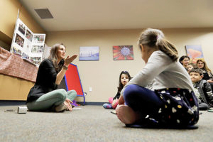 SAY IT IN FARSI — Bahareh Hedyahe (left) leads Persian story time at the library in Irvine, California, one part of the effort to convey Persian culture to a new generation born in the United States.