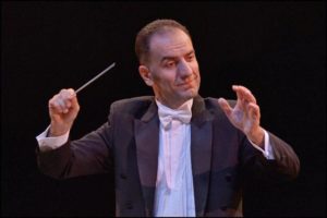 HANDS UP — Iranian-born Mehran Tebyani is  di-rector of the Beverly Hills Philharmonic Orchestra.