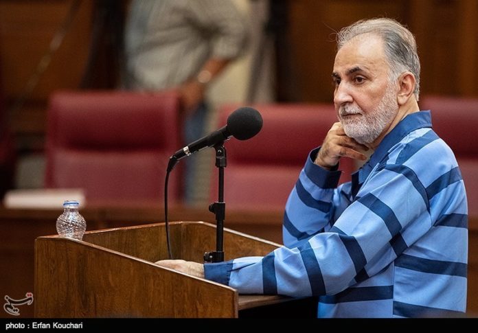 VERDICT — Former Tehran Mayor Mohammad-Ali Najafi stands in court during his trial.