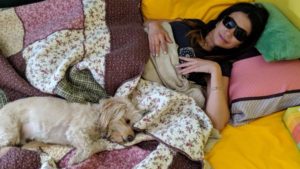 AT HOME — Salome Khandar relaxes with her pooch, Tilu, in Iran before returning to her home in New Zealand, which has very tough veterinary laws, making it hard—and expensive—to bring a pet into the country.