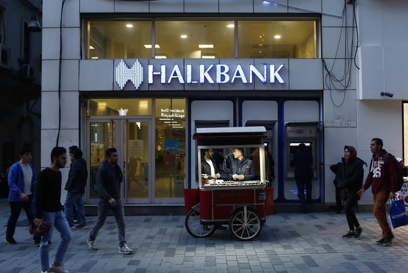 UNDER US INDICTMENT —A branch of Halkbank glows at night in Turkey.