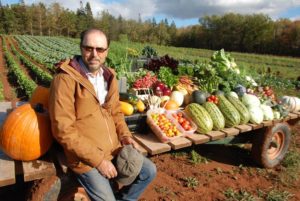 PRODUCE — Aman Sedighi shows off some of his production from his farm