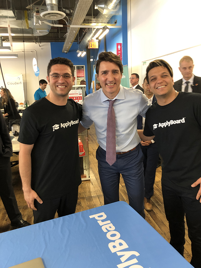 TOP IN THEIR FIELDS — Martin Basiri (left) and his brother Meti (right) pose with Canadian Prime Minister Justin Trudeau in their Ontario offices.