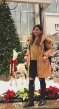 HAPPIER TIMES — Masoumeh Ghavi posed in front of this Christmas tree at Halifax Airport before she flew off to Tehran to visit family and friends.
