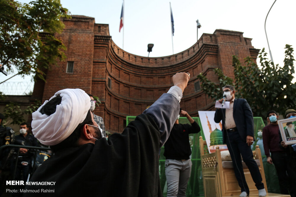 NOW HEAR THIS — Tehranis gathered and protested in front of the French embassy in Tehran. Police prevented anyone from entering the grounds.