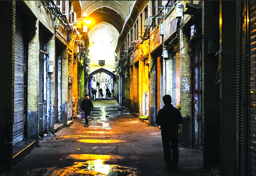 LOCKDOWN — The Tehran Bazaar (above) was closed up tight under new government restrictions. And the streets of Tehran (below) were deserted after the 9 p.m. curfew. But many said other coronavirus restrictions were largely being ignored by the public.