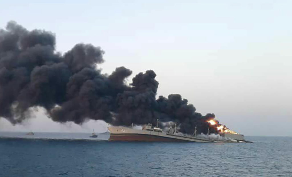 DYING — The Navy’s Kharg starts to roll over and sink in the Gulf of Oman off the port of Jask.