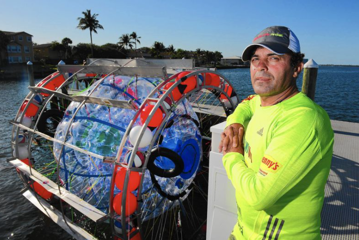 CAGED — Reza Baluchi stands beside his personally designed cage in which he tries, but repeatedly fails, to walk long distances across the ocean.