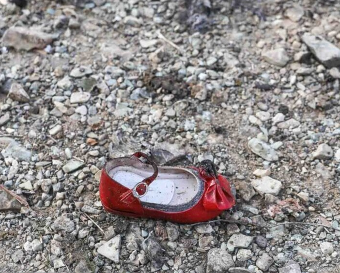 AFTERMATH A little girl’s shoe was among the wreckage after an Iranian missile brought down a Ukrainian airliner in January 2020.