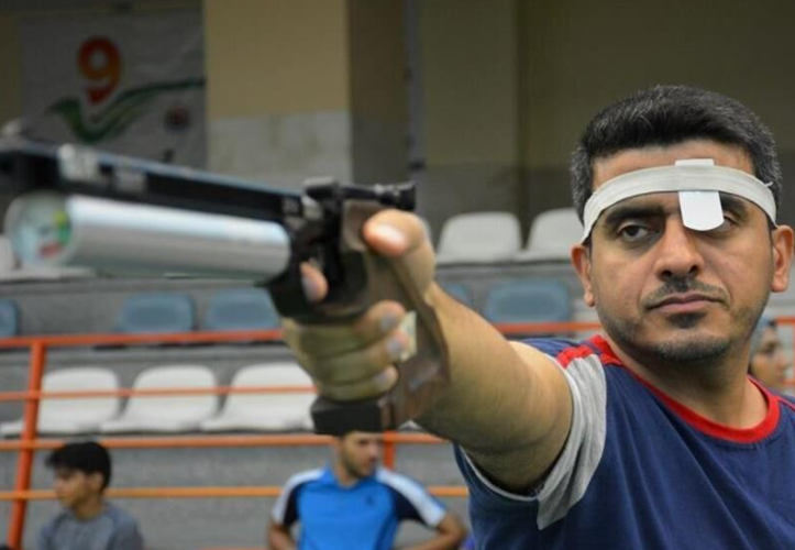 READY, AIM, FIRE Javad Foroughi takes aim with his pistol and goes on to win gold and set a world record.  But is he also a Pasdar sharpshooter who shoots protesters at anti-regime demonstrations in Iran?