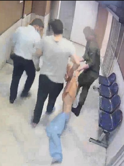 TREATMENT A comatose prisoner is dragged through the corridors of Evin Prison in this video.