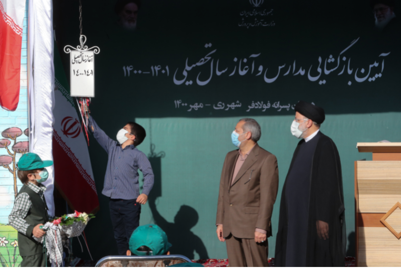 RITUAL — President Raisi (right) attended the ritual of the school term opening at Foladfar Elementary School in Shahr-e Rey, though most students in the big cities are still attending via their cellphones