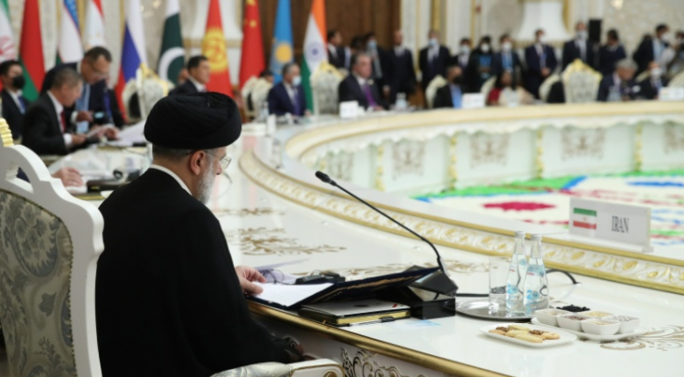 PREPARATION — President Raisi checks his papers as he attends his first international meeting as presdient of the Islamic Republic.